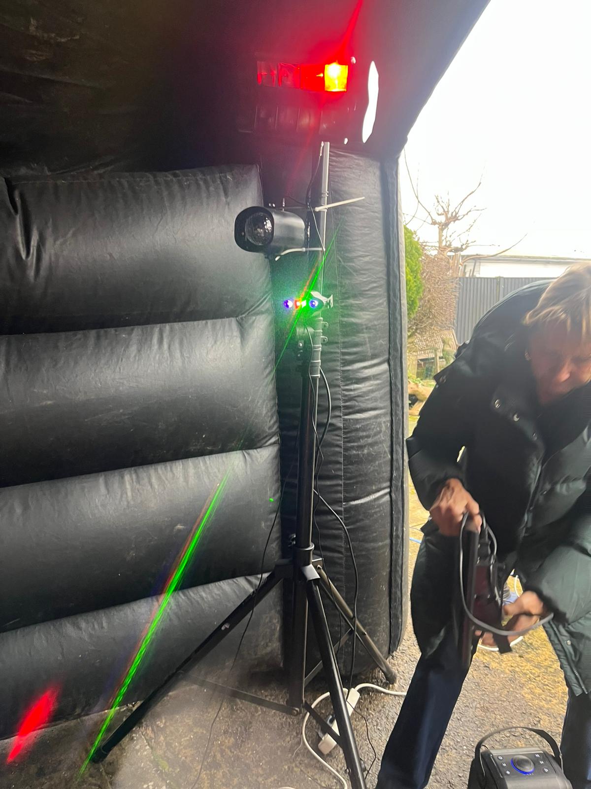 Music and party lighting setup inside inflatable night club hire package